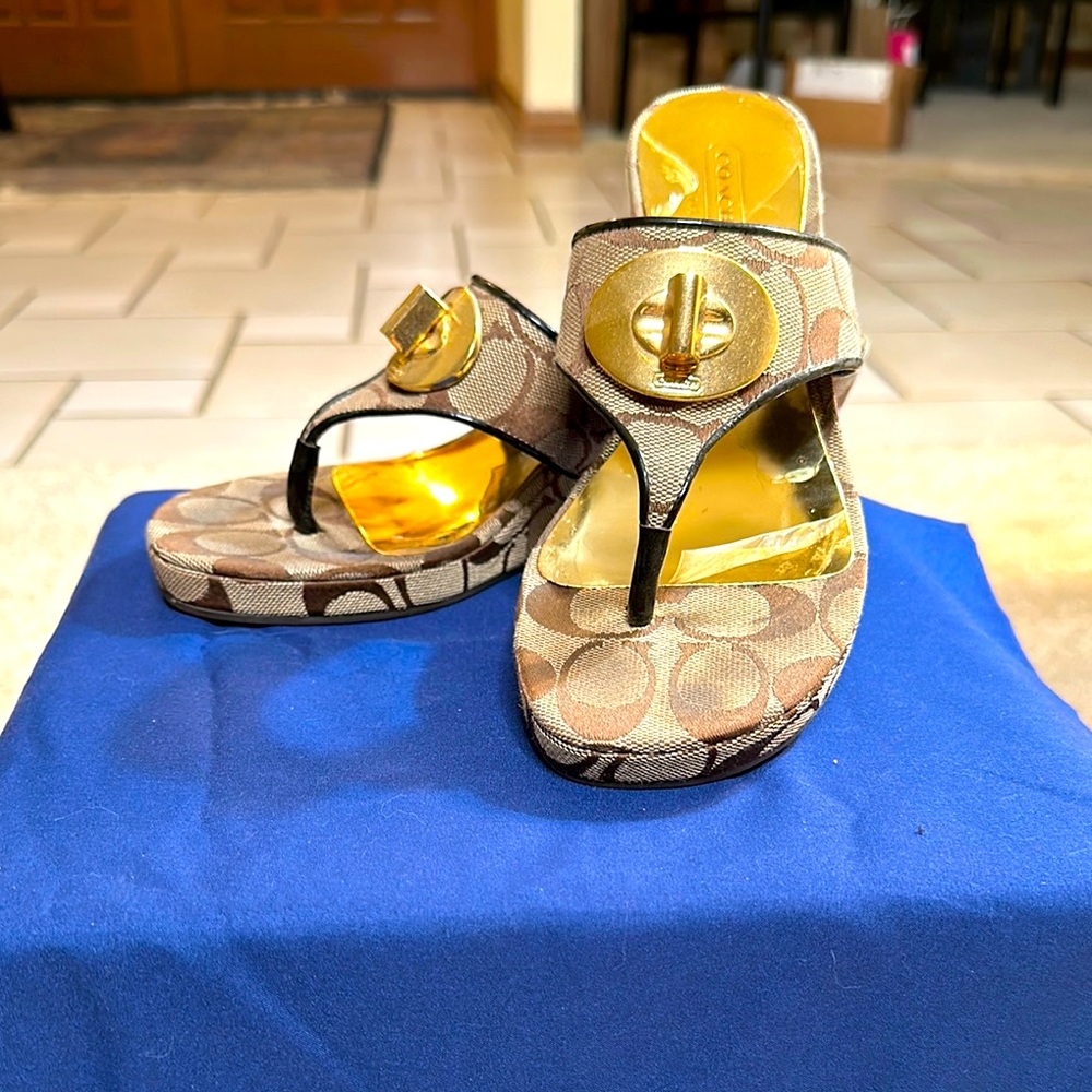 Authentic Coach wedge sandals with gold hardware.